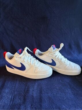 Nike Kids White Sneakers with Blue Swoosh and Red Heel Tab